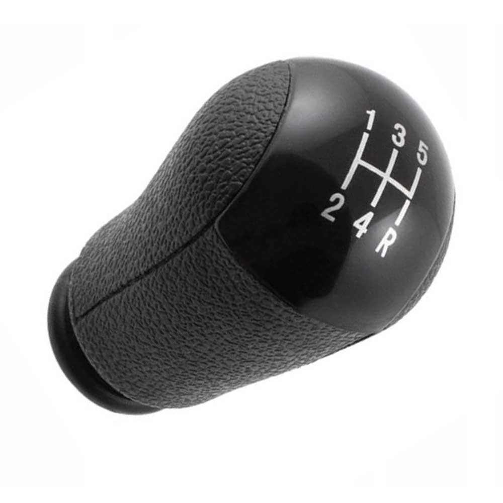 Fekete színű, 5 sebességes Ford váltógomb.