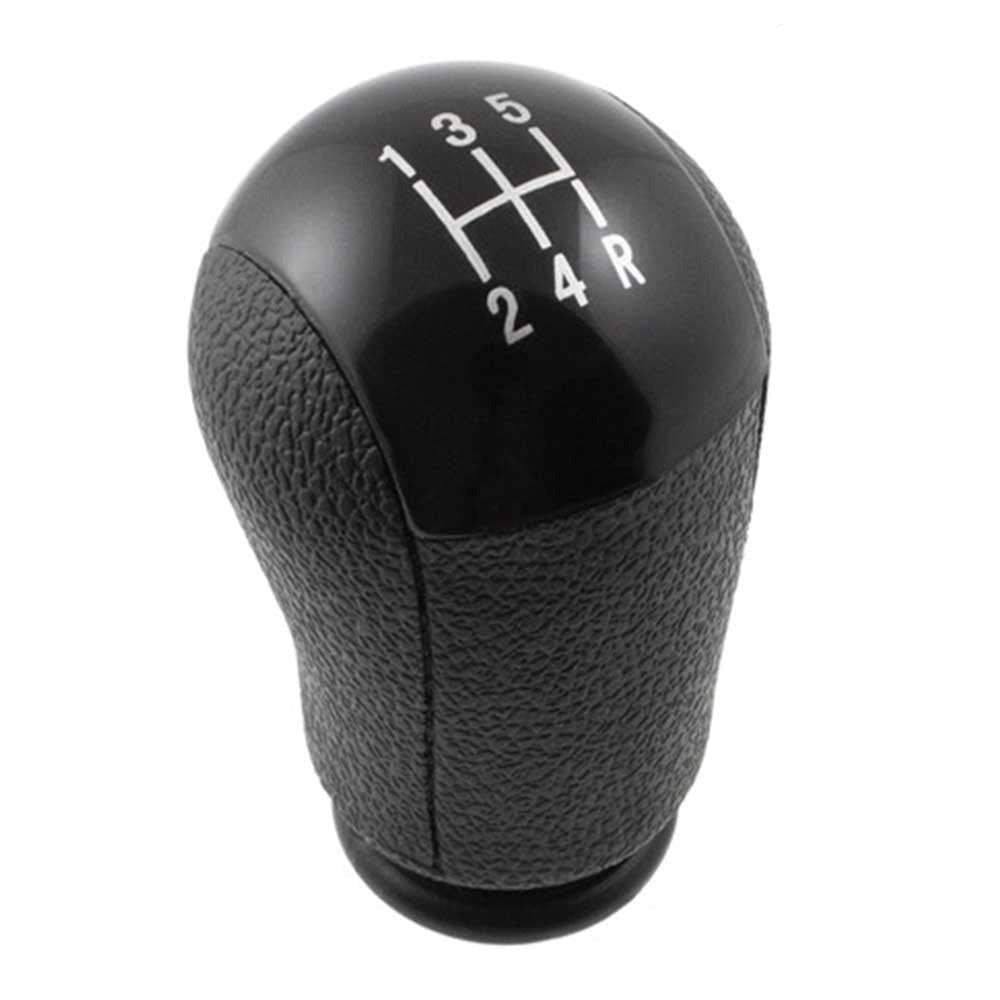 Fekete színű, 5 sebességes Ford váltógomb.