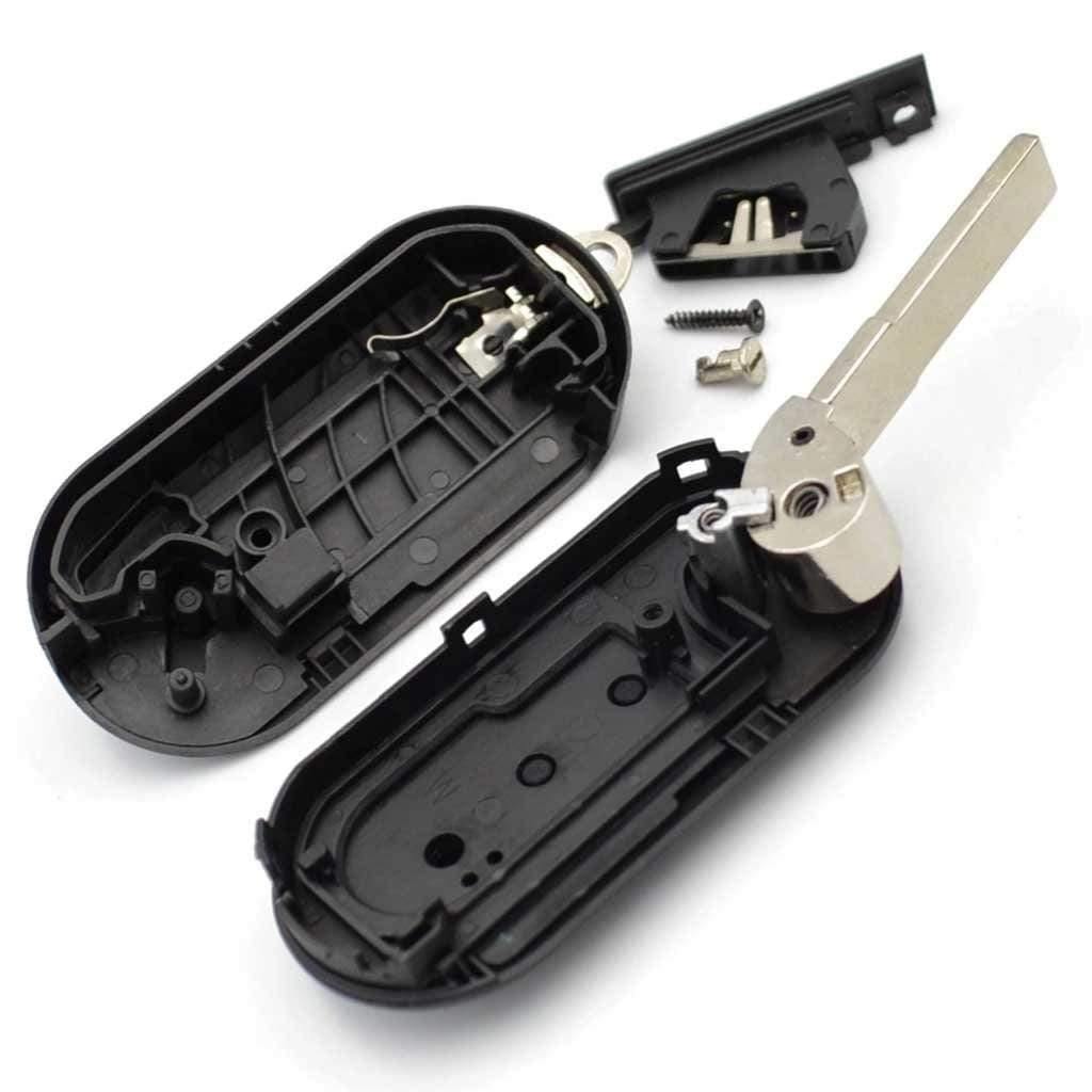 Fekete színű, 2 gombos Lancia bicskakulcs, kulcsház belseje.